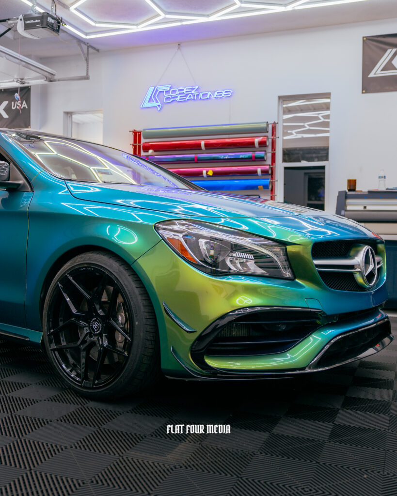 Multi colored vinyl wrap on Mercedes