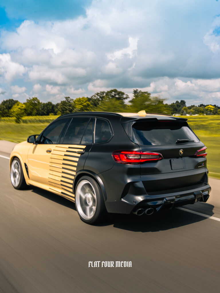 BMW X5 Manhart black and yellow decal wrap