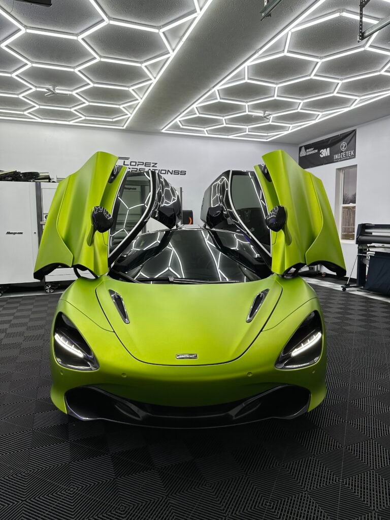 Lime green McLaren 720S with doors up, showpiece vinyl wrap.