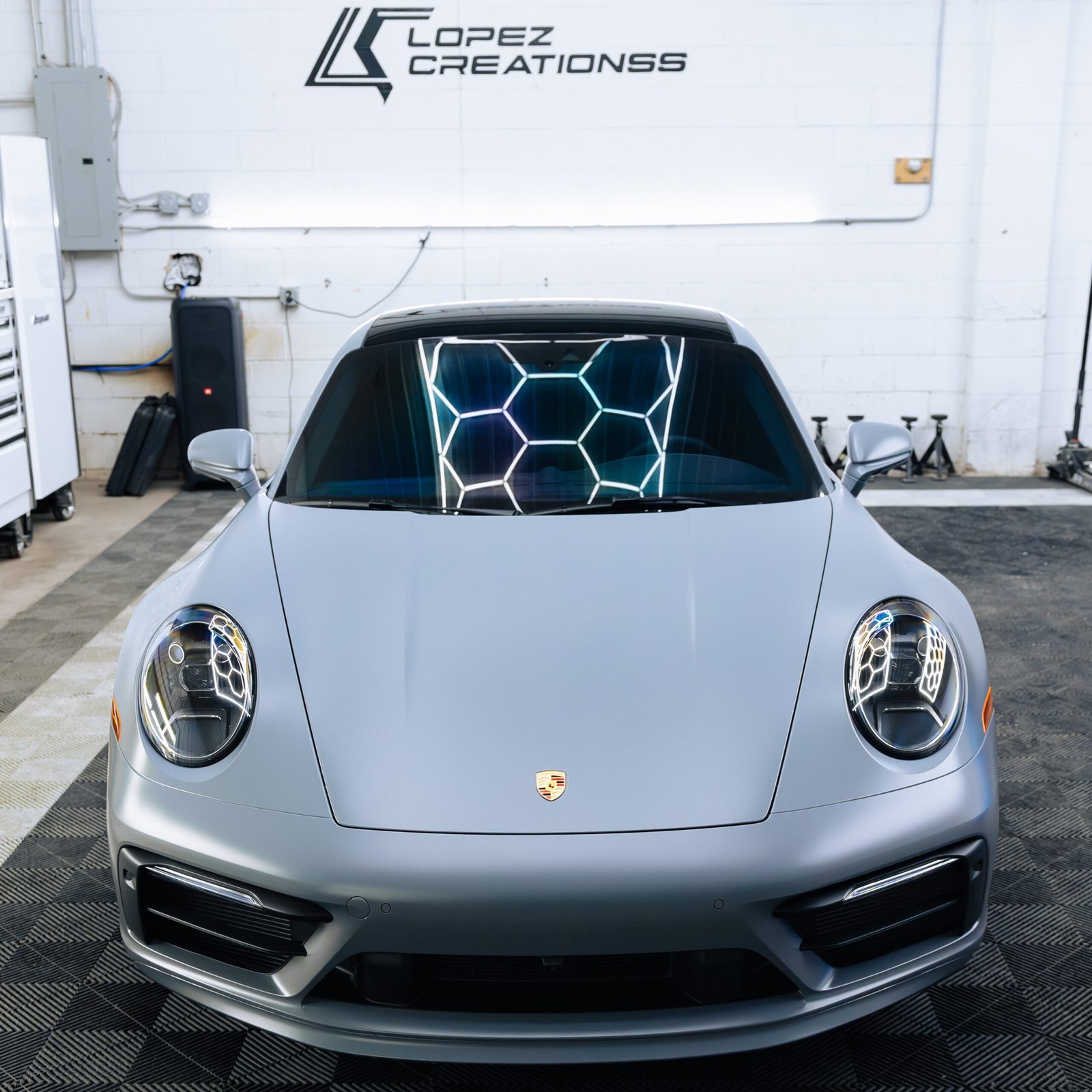 Gray Porsche 911 with stealth Paint Protection Film, and ceramic window tint.