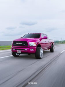 Gloss fuchsia vinyl wrap on Dodge Ram, full color change