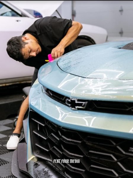 Technician applying PPF to fender, chip protection, Michigan